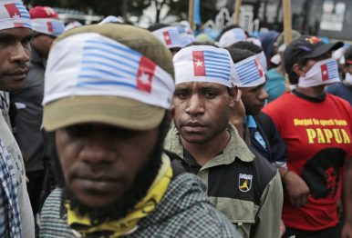 West Papuan protesters wear headbands of banned "Morning Star" flag during a rally calling for the remote region's independence, in Jakarta, Indonesia, Thursday, Dec. 1, 2016. Image Credit: AP Photo/Dita Alangkara