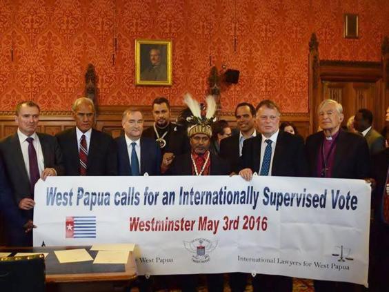 Free West Papua independence leader Benny Wenda (centre) was granted political asylum from the UK in the early 2000s 